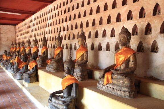 Buddha Statues in Rows at Wat Si Saket Temple Wat Si Saket, built in 1818, is renowned for its collection of thousands of miniature Buddha statues