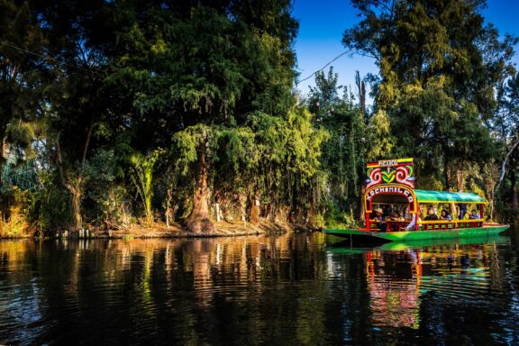 Colorful Boat on Xochimilco Canal Trajinera boat ride through Xochimilco