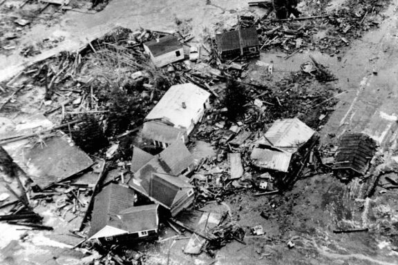 A black-and-white, aerial view of damaged buildings in Seward, Alaska after the Great Alaska Earthquake in 1964.