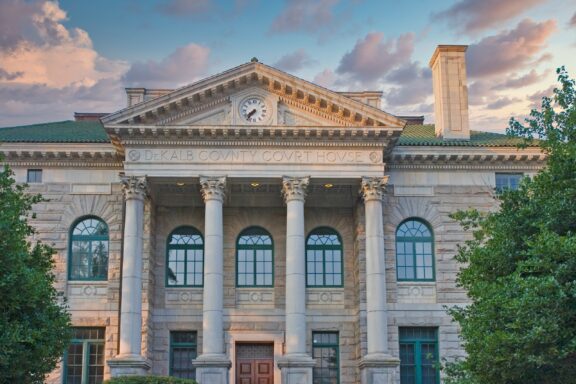Facade of the DeKalb County Courthouse at Dusk A view of the front of the DeKalb County Courthouse in Decatur, Georgia.