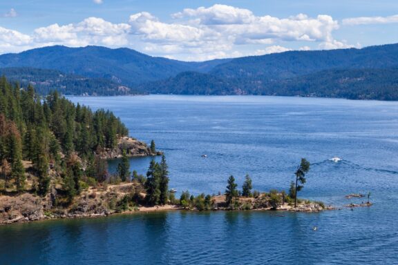 A view of green hills and water around Tubs Hill in Coeur d’Alene, Idaho.