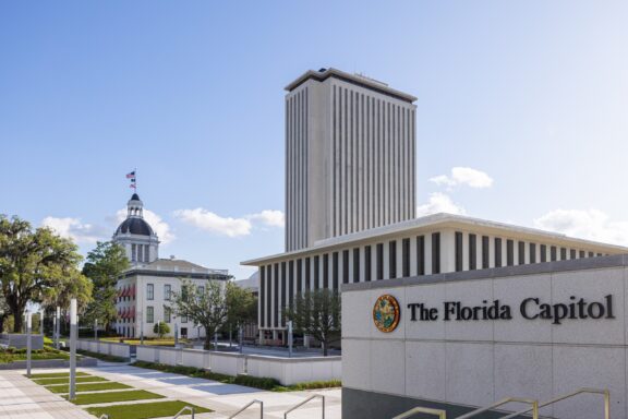 View of The Florida Capitol Complex in Tallahassee on a Sunny Day A view of the old and new Florida State Capitols standing next to each other in Tallahassee, Florida.