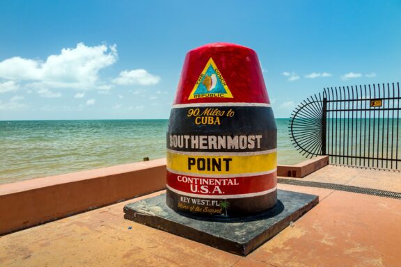 A buoy marking the southernmost point of the contiguous United States sits on a dock in Key West, Florida.