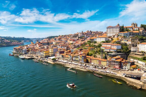 A view of the Douro River as it passes through Porto, Portugal on a sunny day. 