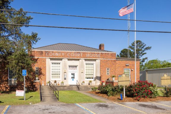 An American flag flies outside the front of the Quitman County Courthouse in Georgetown, Georgia.