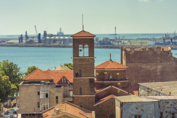 The old town of Constanta, Romania can be in the foreground, and the city’s port lies in the distance in the Black Sea.