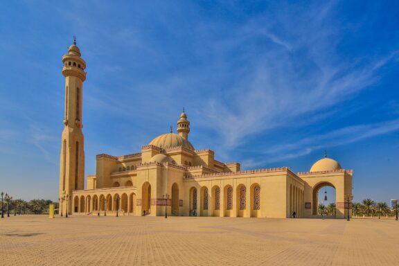 Al-Fateh Mosque under Blue Sky Al-Fateh Mosque, one of the largest mosques in the world, capable of accommodating over 7,000 worshippers