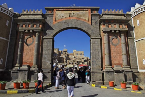 Bab al-Yemen Gateway with People Bab al-Yemen, an iconic gate built in the 17th century that serves as the main entrance to the Old City of Sana'a