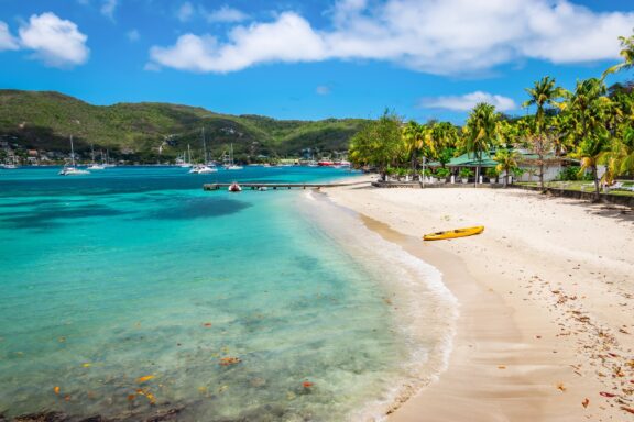 Tropical Beach with Canoe on Shore Bequia Island, a nautical paradise just a short ferry ride from Kingstown