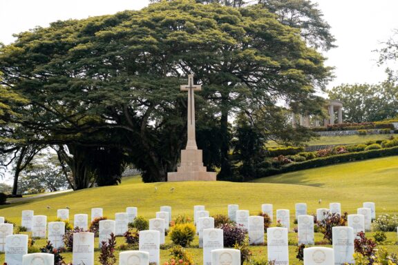 War Cemetery with Cross Monument and Gravestones Bomana War Cemetery, the resting place for over 3,000 Commonwealth soldiers