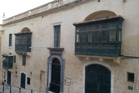 Traditional Maltese Balcony on Limestone Building Facade Casa Rocca Piccola, a 16th-century palace