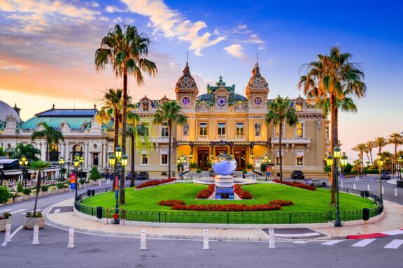Sunset View of Casino de Monte Carlo with Palm Trees Casino de Monte-Carlo, opened in 1863, this world-renowned casino has been featured in numerous films