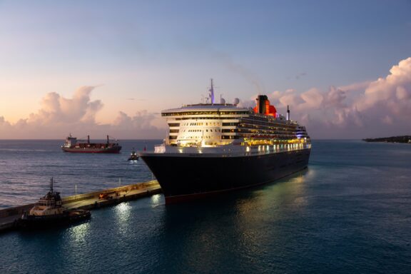 Cruise Ship Docked at Barbados at Dusk Cruise ship docking at Bridgetown, pivotal to Barbados' economy