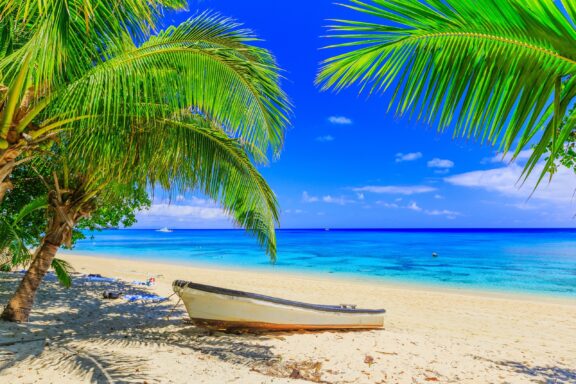 Tropical Beach with Canoe Dravuni Island, a popular excursion point accessible by boat
