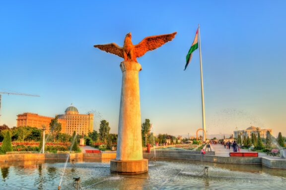 Eagle Statue and Flagpole in Dushanbe Park at Sunset National Flag Park symbolizes Tajik national pride and is home to one of the world's tallest flagpoles