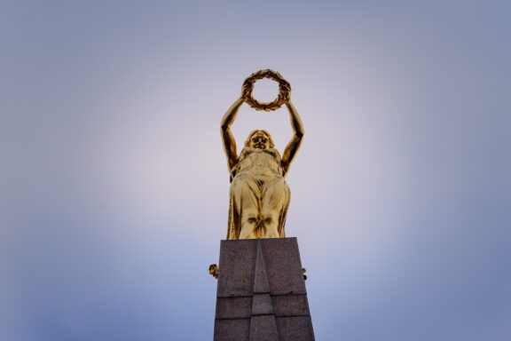 Statue of a Woman Holding a Wreath Against Sky Gëlle Fra Monument, erected to honor Luxembourgers who fought in World War I and II