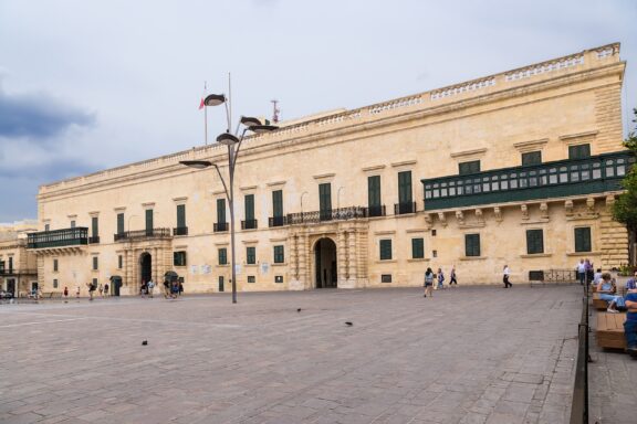 Grandmaster's Palace Facade with Visitors Grandmaster's Palace, constructed in the late 16th century, served various administrative purposes and is currently the presidential office