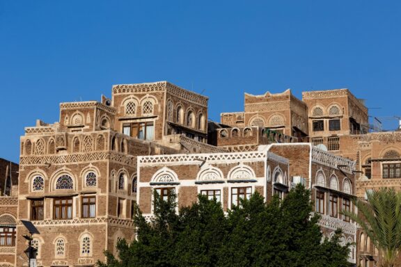 Traditional Yemeni Buildings Against Blue Sky Traditional architecture buildings in Sana'a, dating back over 2,500 years