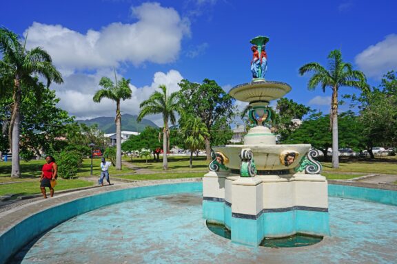 Fountain at Independence Square with People Walking Independence Square, formerly known as Pall Mall Square, has historical roots as a slave market