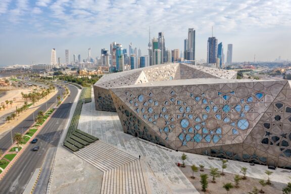 Modern Cultural Center with Geometric Facade in Urban Landscape Jaber Al-Ahmad Cultural Centre (JACC): Known for its cutting-edge design