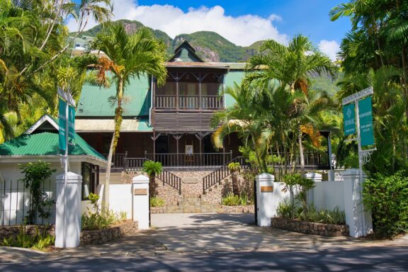 Colonial Style Building Surrounded by Tropical Vegetation Kenwyn House Gallery, housed in a French colonial villa built in 1855