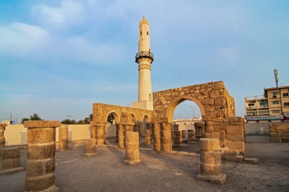 Ruins of Khamis Mosque with Minaret at Sunset Manama bahrain may 18 2018: al khamis mosque in