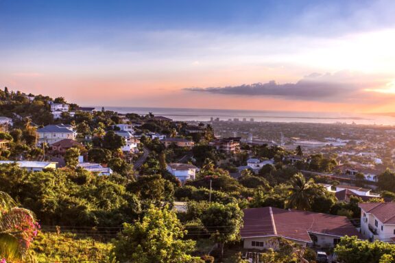 Juxtaposition of Kingston's sprawling urban landscape against the scenic hills