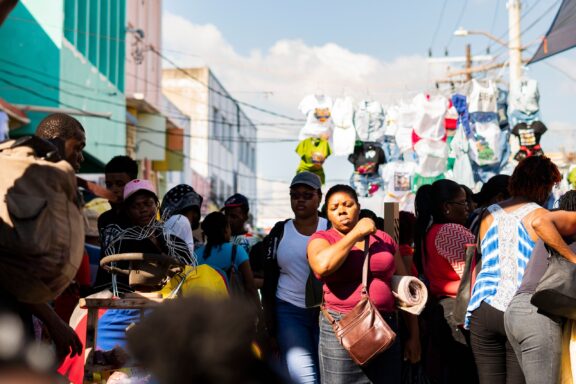 Bustling Street Market Scene with People Crowded streets near the coronation market