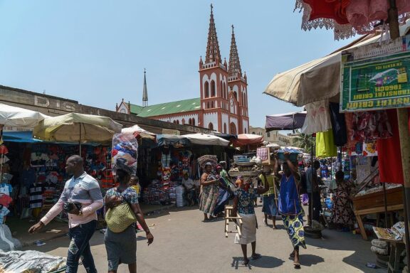 Street Market in Lomé with Cathedral in the Background Grand Marché, an epicenter of commercial activity in Lomé