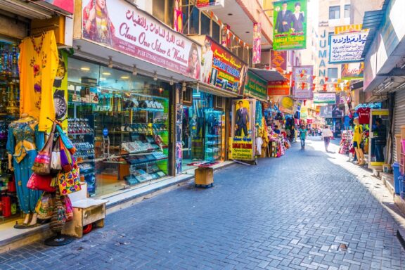 Colorful market street with shops Narrow streets at the Souq Bab Al Bahrain