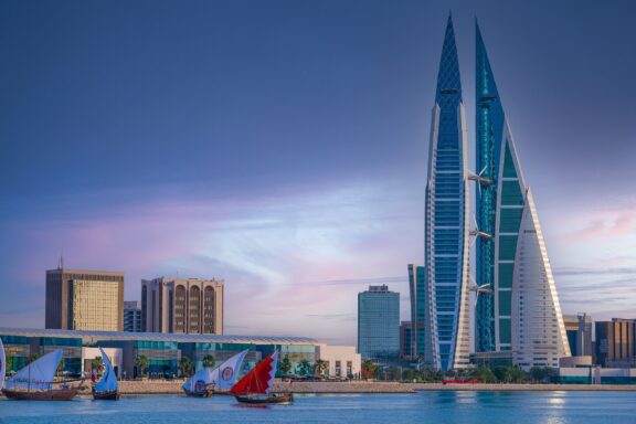 Dusk View of Bahrain World Trade Center with Sailing Boats Bahrain World Trade Center, serving as a hub for business and commerce