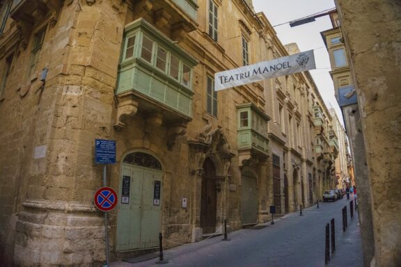 Exterior View of Manoel Theatre in Urban Street Setting Manoel Theatre, built in the early 18th century, is one of the oldest working theaters in Europe