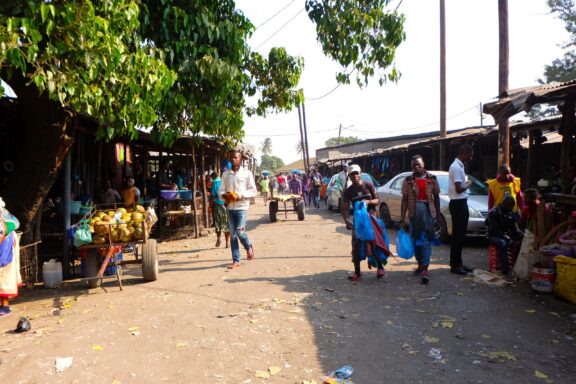 Bustling Market Scene in Maputo Locals stroll through Maputo's fresh markets, an everyday scenery in the city