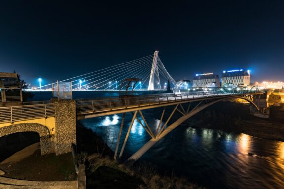 Illuminated Suspension Bridge at Night Millennium Bridge, one of Podgorica's modern landmarks