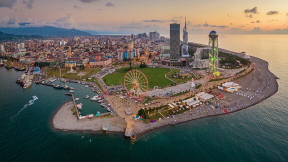 An aerial view of the coastline of Batumi, Georgia at sunset.