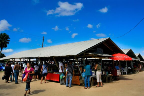 Bustling Outdoor Market Scene with Shoppers Crowded markets in Paramaribo