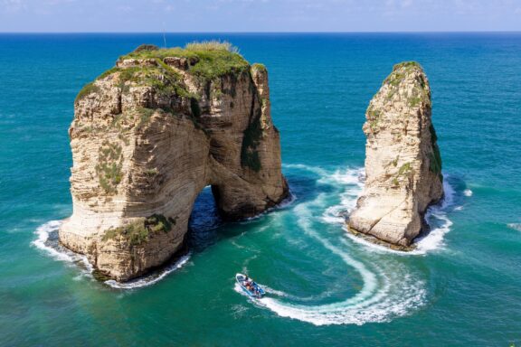 Aerial View of Sea Cliffs and Boat Pigeon Rocks, an iconic natural formations off the coast of Beirut