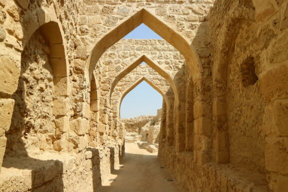 Arched Stone Corridors of Qal'at al-Bahrain Qal'at al-Bahrain dates back to 2300 BC and has served as a fort, trading center, and residence
