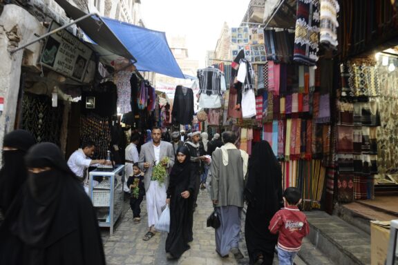 Crowded narrow streets of Sana'a, serving as a hub for commerce and social interaction