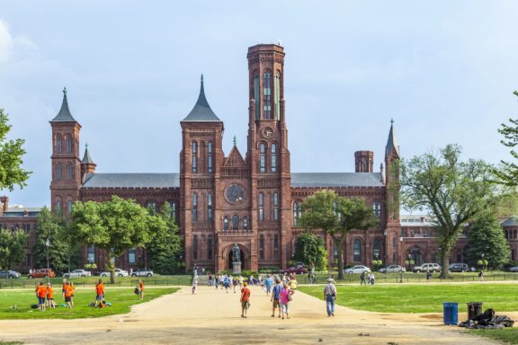 Visitors Walking Towards the Smithsonian Castle on a Sunny Day Washington usa july 14 2010: smithsonian castle in washington