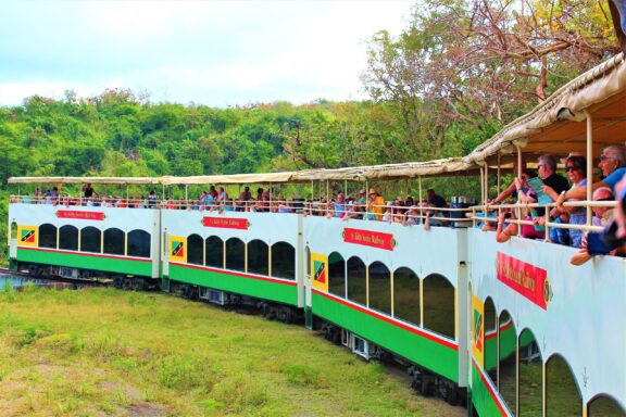 Tourists on Scenic Railway Tour in St. Kitts St. Kitts Scenic Railway, originally built to transport sugar cane