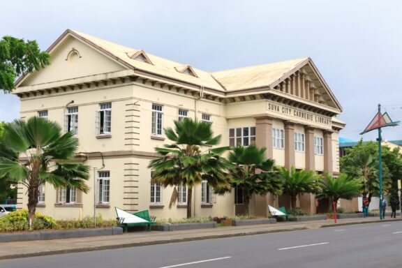 Colonial-style Building with Palm Trees Suva City Carnegie Library, founded in 1909