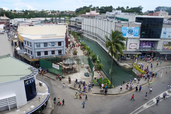 Aerial View of Busy Commercial Street with Canal Commercial area in Suva