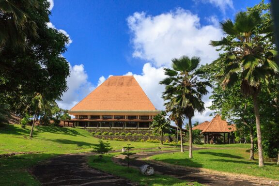 Traditional Fijian Building Surrounded by Tropical Vegetation Suva Old Parliament, established in the late 19th century, hosted Fiji's legislature until 1988