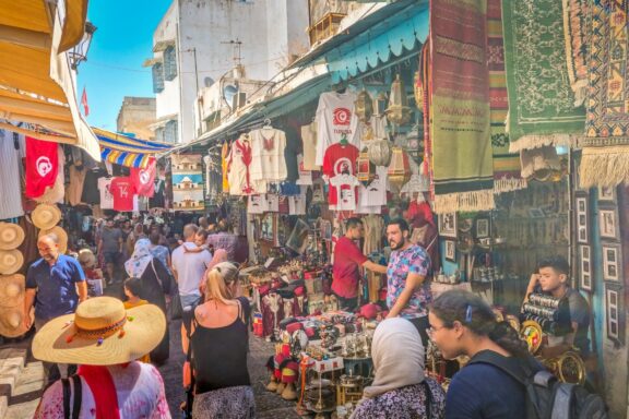 Residents stroll through the bustling markets within the city