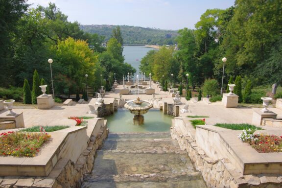 Scenic View of Cascading Fountains at Valea Morilor Park Valea Morilor Park, known for its scenic lake and lush landscape.