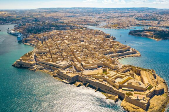 Aerial View of Valletta Cityscape and Coastline The grand cityscape of Valletta