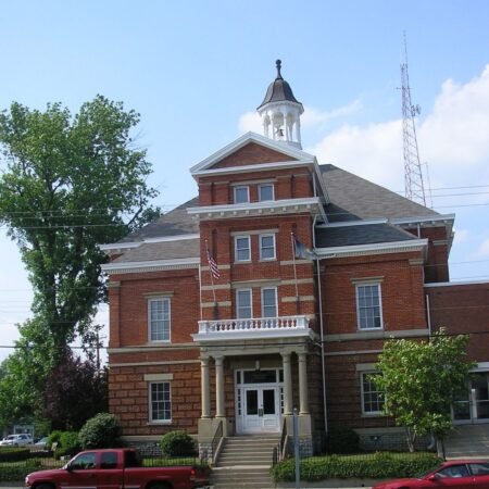 A street-level view of the brick facade of the old Boone County Courthouse in Burlington, Kentucky. 