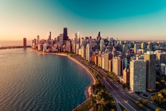 An aerial view of the Chicago skyline bordering Lake Michigan.