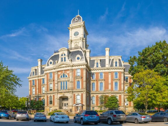 A street-level view of the Hamilton County Courthouse in Noblesville, Indiana on a sunny day.